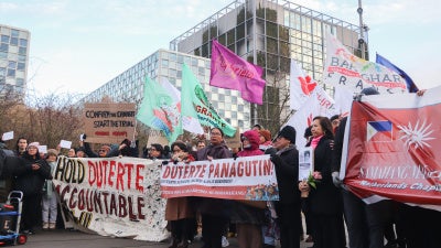 Victims’ families and activists gather outside the International Criminal Court in The Hague to demand justice for the thousands of people killed during the abusive “drug war” of former Philippine President Rodrigo Duterte, February 23, 2026.