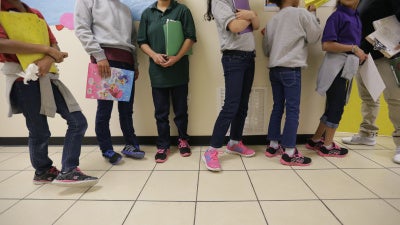 Migrant teens line up for a class in San Benito, Texas, in August 29, 2019.