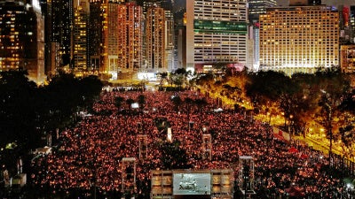 People attending a candlelight vigil