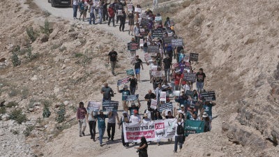 Activists rally in support of the Bedouin communities of Khan al-Ahmar in the occupied West Bank, June 12, 2026. 