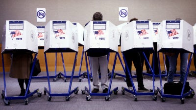 Voters fill out their ballots at a polling station in New York City on Election Day, November 5, 2024.