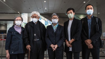 Former trustees of the 612 Humanitarian Relief Fund, following a verdict at the West Kowloon Magistrates' Courts in Hong Kong, November 25, 2022.