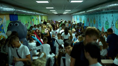Children, parents, and teachers shelter underground during an air raid alert amid traditional back-to-school celebrations in Kyiv, Ukraine, September 1, 2026.