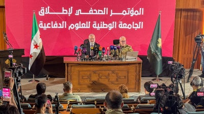 Officials from the Syrian Ministry of Defense hold a press conference announcing the launch of the National Defense Sciences University in Damascus, Syria, July 13, 2026. 