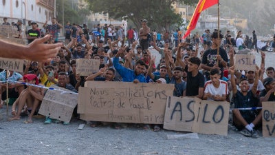  People on Trampolín beach in Ceuta, Spain, protesting to be allowed apply for asylum, August 2026.