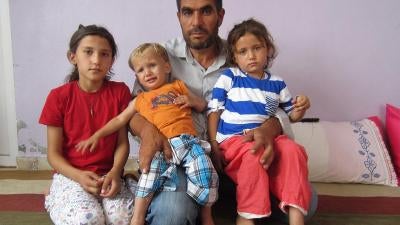 Mohammed, 42 and three of his relatives who were orphaned in the attack on June 25, 2015 in Kobani, Syria. 