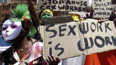 Sex workers wearing masks lead a march to mark International Sex Workers Rights Day in Johannesburg March 3, 2011