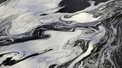 Coal ash swirls on the surface of the Dan River in Danville, Virginia