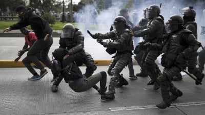 Police detain an anti-government demonstrator during a nationwide strike in Bogota, Colombia, on November 21, 2019.