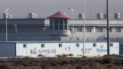In this Monday, Dec. 3, 2018, file photo, a guard tower and barbed wire fences are seen around a facility in the Kunshan Industrial Park in Artux in western China's Xinjiang region. China has responded with swift condemnation on Wednesday, Dec. 4, 2019, a