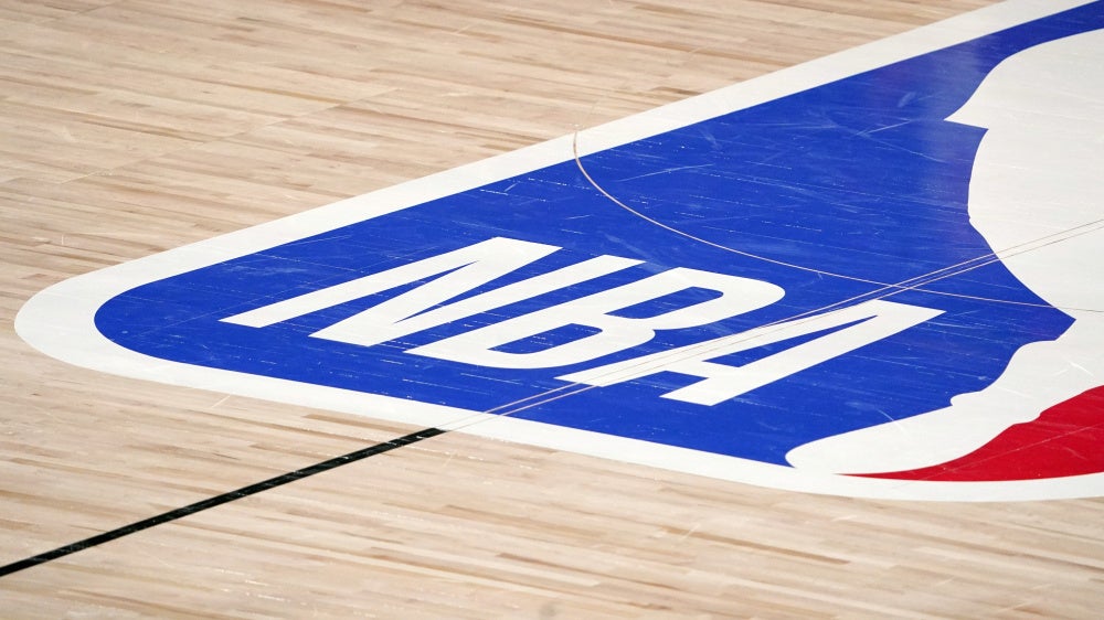 The NBA logo at center court. 