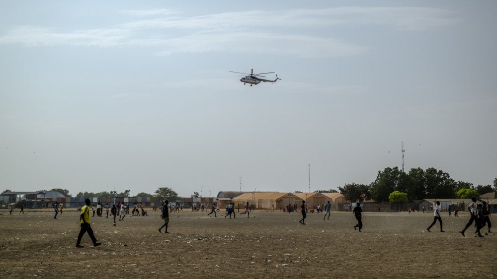 A UN helicopter performs a routine patrol over the Bentiu internally displaced persons camp in Unity State, South Sudan, on November 4, 2025.