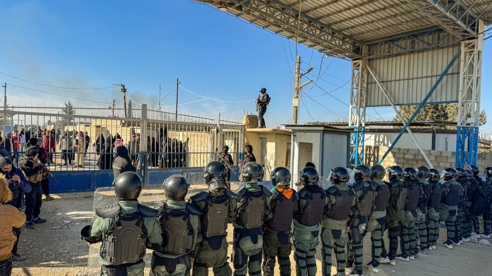 Syrian security forces take control of al-Hol camp in the desert region of al-Hasakah Province, Syria, on January 21, 2026, following the withdrawal of Kurdish forces the previous day.