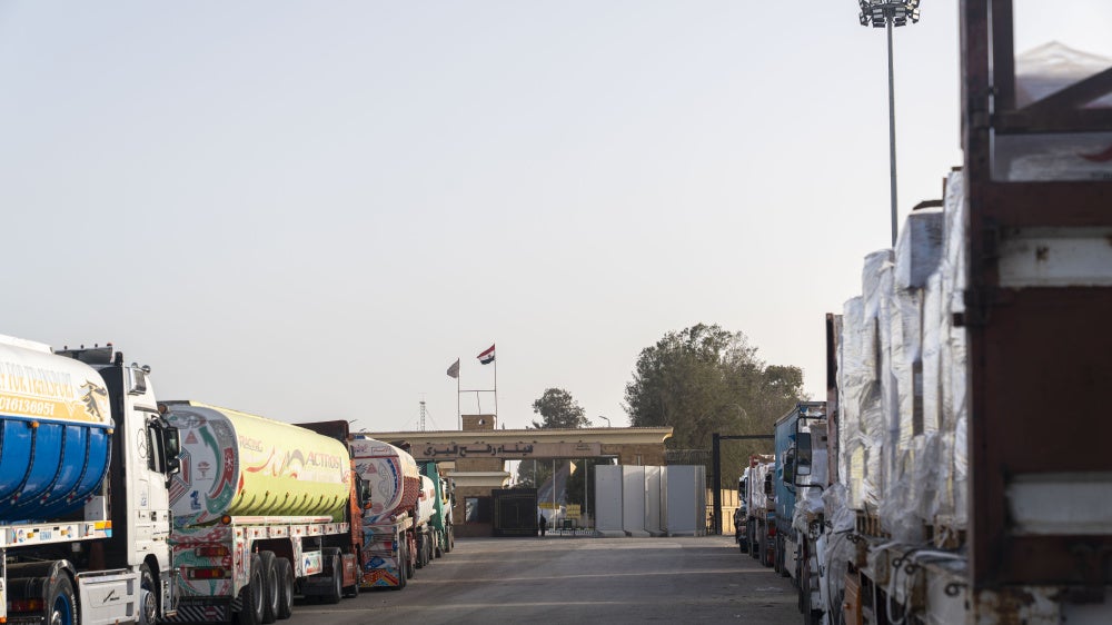 Trucks carrying humanitarian aid wait in Egypt at the Rafah crossing to enter Gaza on January 27, 2026. 
