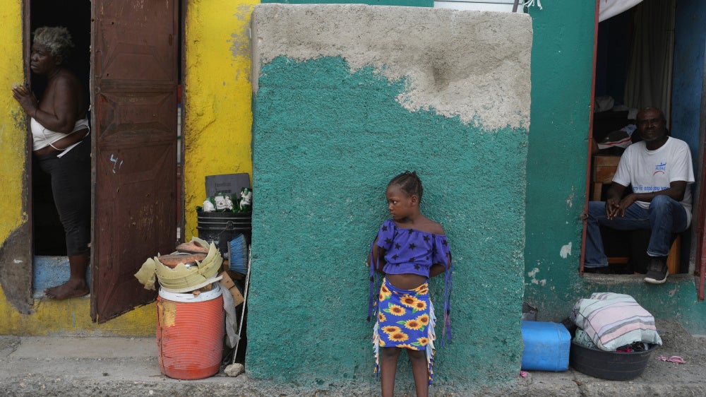 People look out at a street in the Simon-Pele neighborhood of Port-au-Prince, Haiti, September 22, 2025.