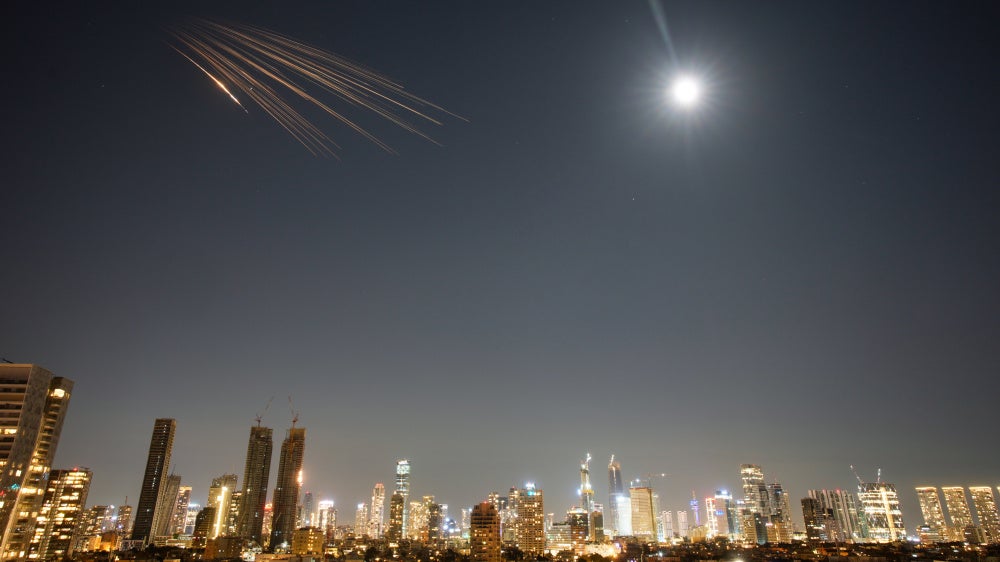 Missiles launched from Iran carrying suspected cluster munitions streak across the sky over central Israel, March 5, 2026.