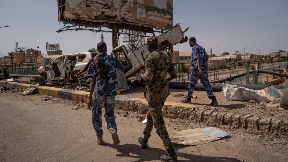 Soldiers of the Sudanese Armed Forces walk on the Shambat Bridge in Khartoum, April 27, 2025.