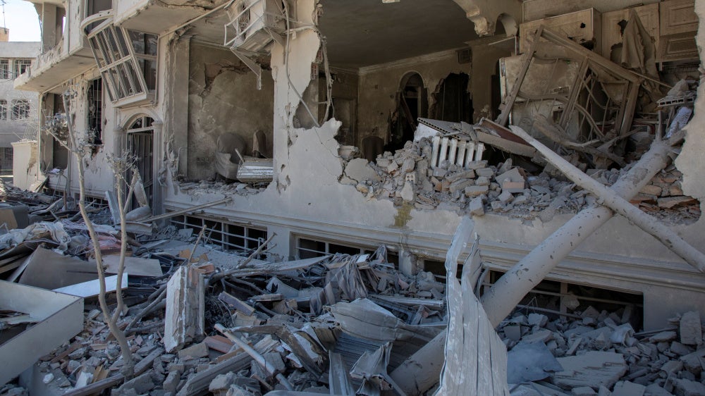 Debris tumbles from a residential building hit in an airstrike  on March 30, 2026 in Tehran, Iran. 