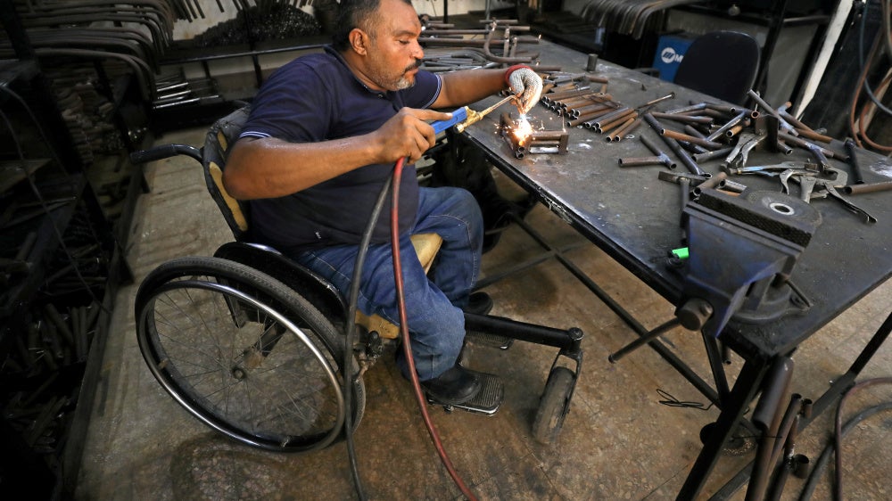 A man with a physical disability builds mobility products for underserved communities in Cairo, Egypt, August 8, 2017.