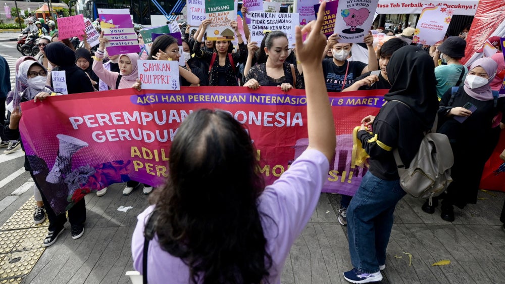 People rally on International Women's Day in Jakarta demanding the Indonesian government pass an anti-discrimination law and ratify the International Labor Organization (ILO) convention concerning the elimination of sexual violence and harassment at work, March 8, 2024.