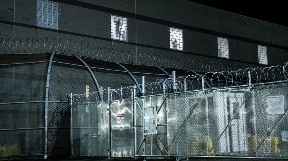 The silhouettes of detainees being held at Delaney Hall during a protest on May 30, 2026, in Newark, New Jersey.