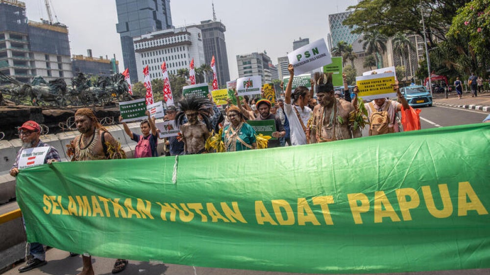 Representatives of the Merauke indigenous community with Yasinta Moiwend (center) protested in Jakarta against the large-scale rice field development project that threatens their land in Indonesia, 2025.
