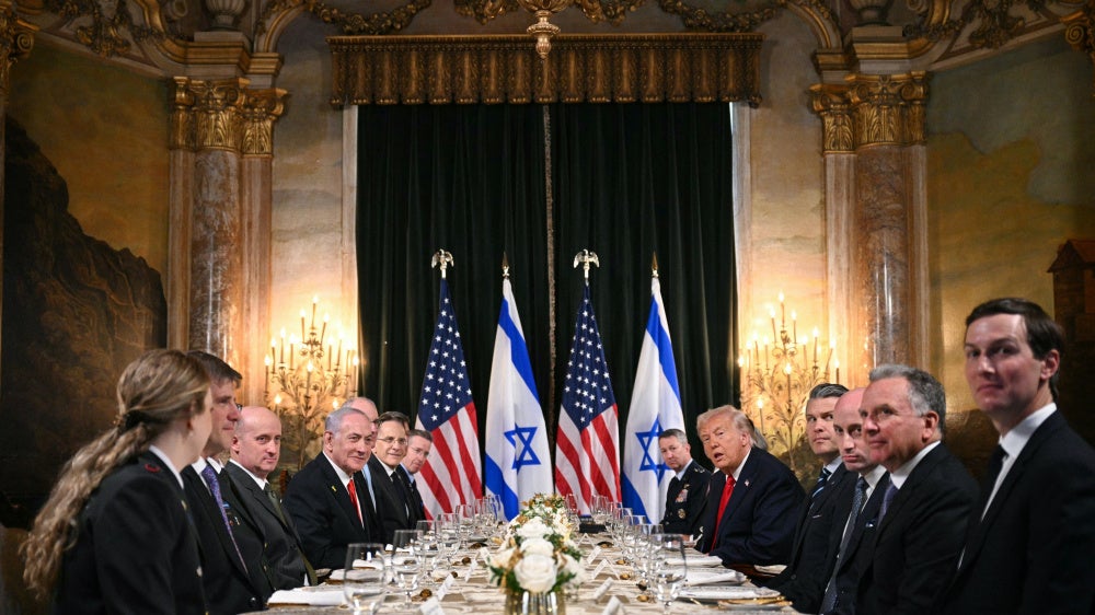 US President Donald Trump (center-right) meets with Israeli Prime Minister Benjamin Netanyahu (center-left) during a bilateral meeting at Trump's Mar-a-Lago residence in Palm Beach, Florida, on December 29, 2025.