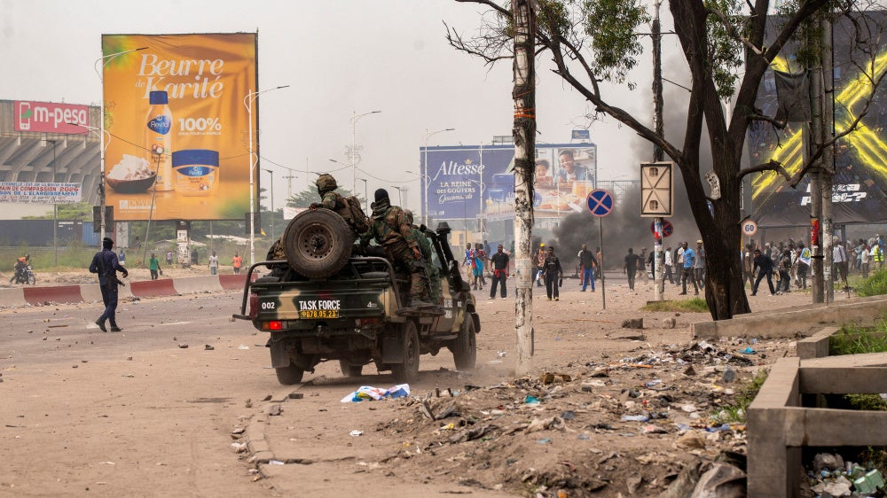 Security forces disperse protesters near the parliament building in Kinshasa, Democratic Republic of Congo, June 12, 2026.