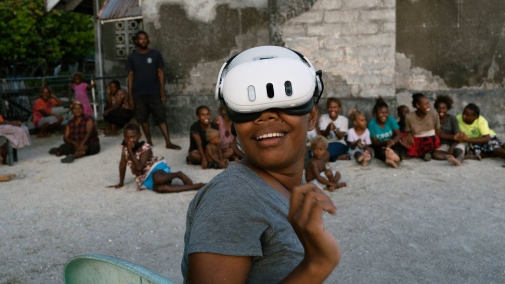 A resident of the Ngongosila community in Malaita Province, Solomon Islands views Virtual Reality content during a demo session.