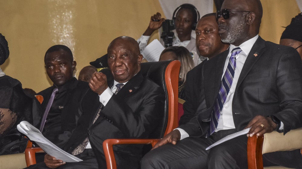 Liberian President Joseph Boakai (second from the left) and Liberian Speaker for the House of Representatives Richard Nagbe Koon (right) in Zwedru on June 27, 2025. 