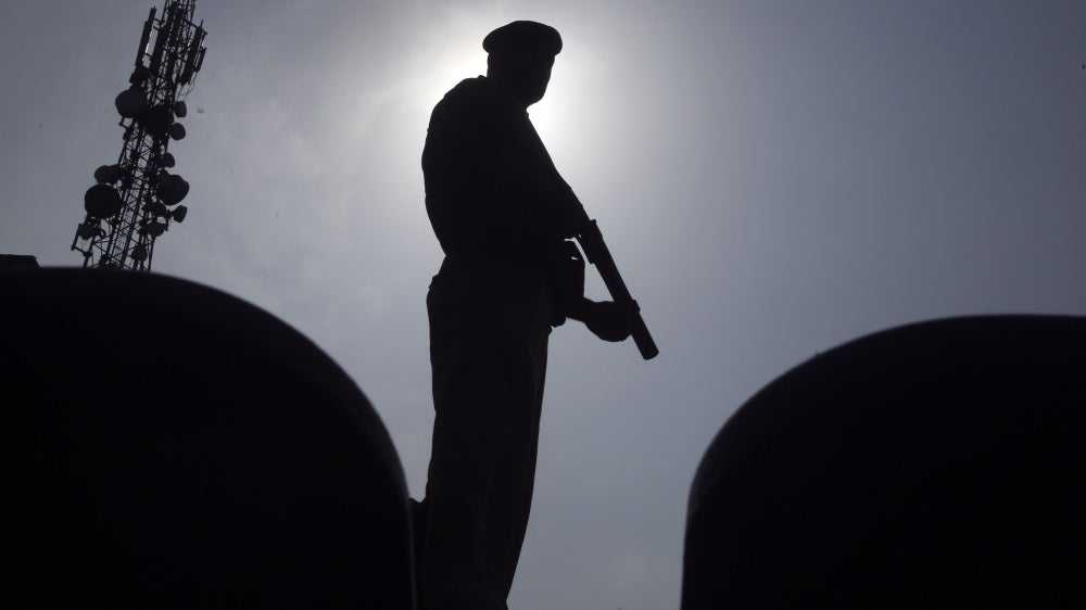 A police officer stands guard in Peshawar, Pakistan, August 5, 2023.