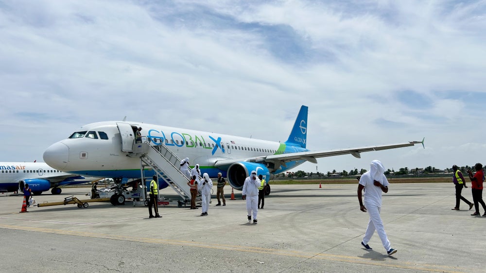 Haitians deported from the United States disembark from a charter flight at Cap-Haïtien International Airport, Haiti, August 27, 2026.