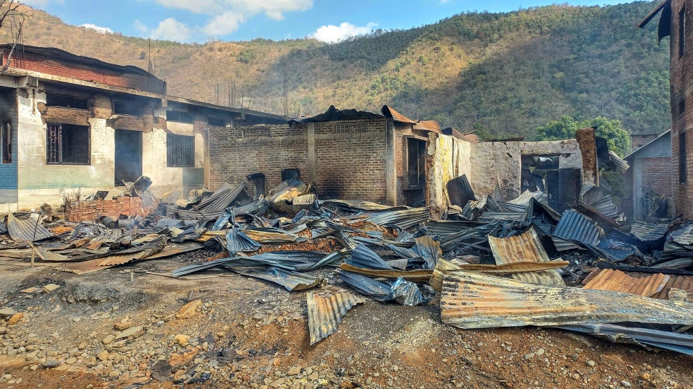 Charred remains of a building following a violent clash between the Tangkhul Naga and Kuki tribes at Litan village, in Ukhrul, Manipur, India, February 10, 2026. 