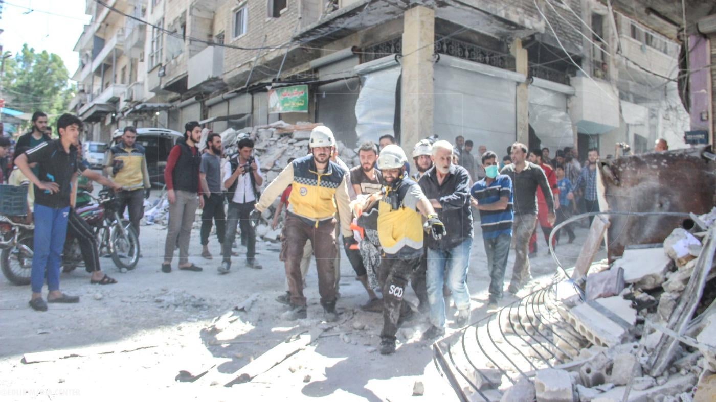 On May 27 a large munition struck a residential area in the town of Ariha, across from the Banat Ariha school, killing at least 13 civilians and wounding at least 21, including four members of Fadel Faham’s.