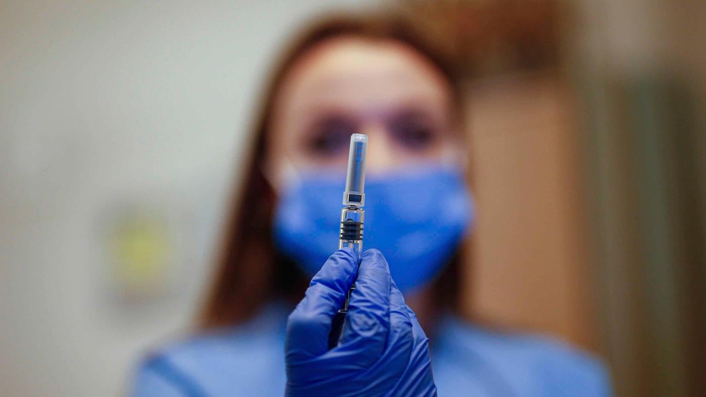 A health worker displays a dose of a Covid-19 vaccine in Istanbul, Turkey on October 9, 2020.