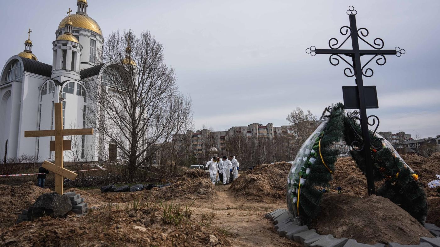  A mass grave is exhumed by Ukrainian authorities on April 8, 2022, as they attempt to identify the bodies of civilians who lost their lives during the Russian occupation of Bucha, Ukraine.
 © 2022 Wolfgang Schwan/Anadolu Agency/Getty Images