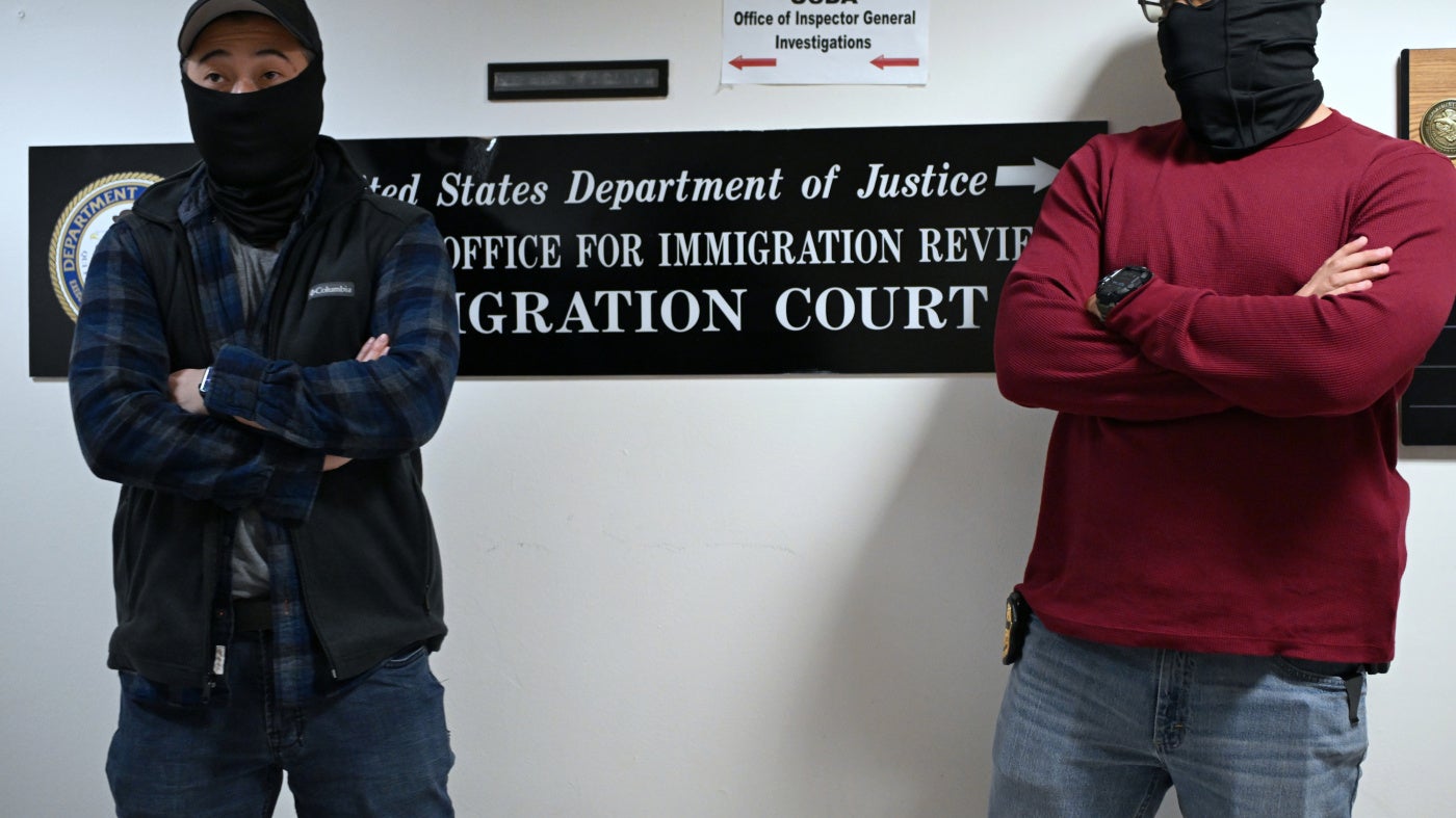 Masked US federal agents outside the immigration court in Manhattan's 26 Federal Plaza, New York City, October 31, 2025.