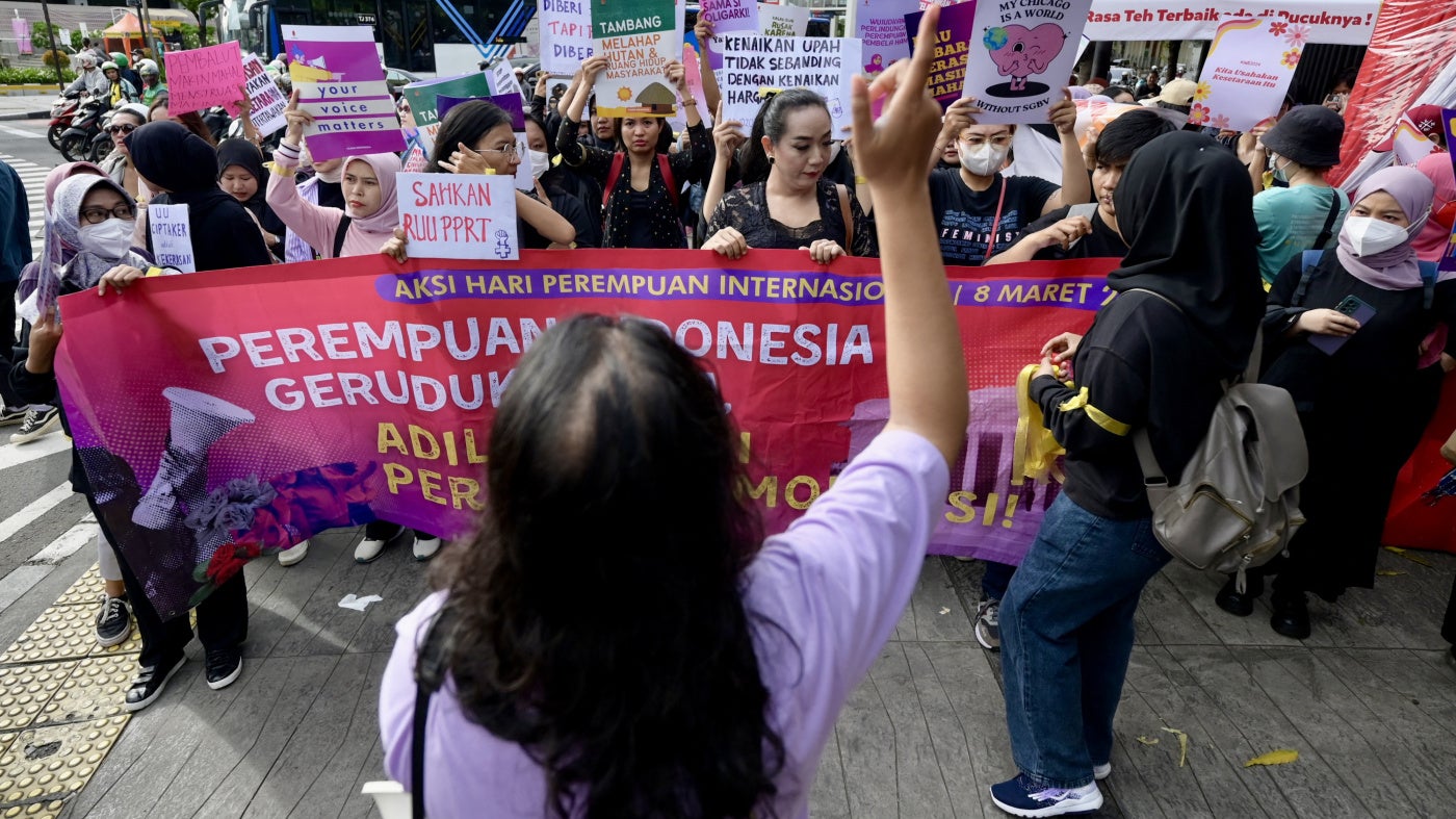 People rally on International Women's Day in Jakarta demanding the Indonesian government pass an anti-discrimination law and ratify the International Labor Organization (ILO) convention concerning the elimination of sexual violence and harassment at work, March 8, 2024.