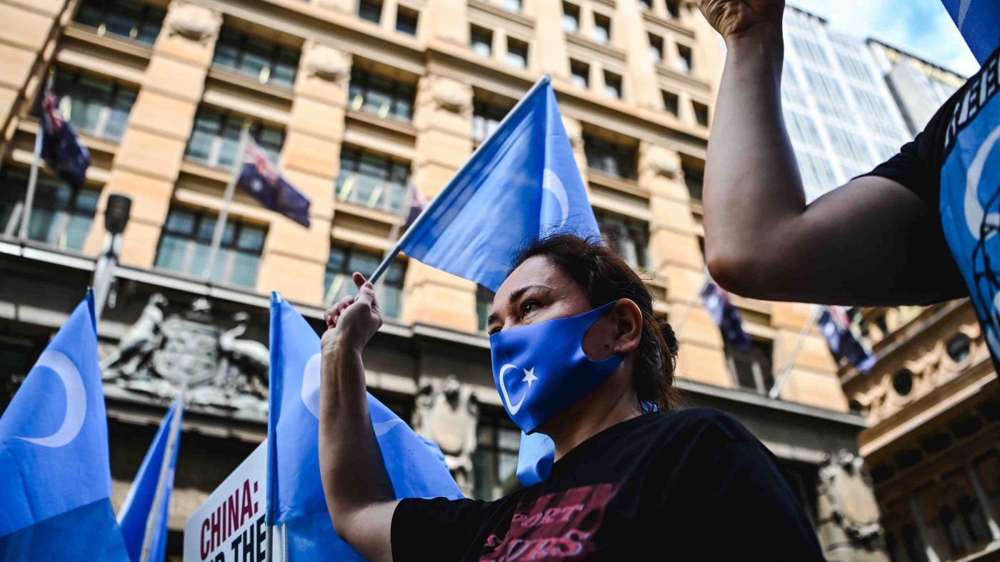 Protesters gather for a rally outside Channel 7 studios in Sydney, Australia, February 4, 2022. 