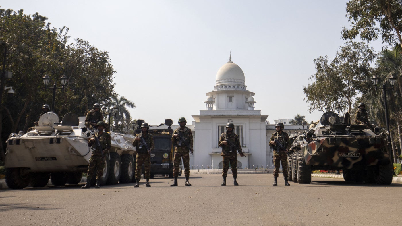 Bangladesh military and Rapid Action Battalion personnel stand guard outside the Supreme Court in Dhaka, February 8, 2025.