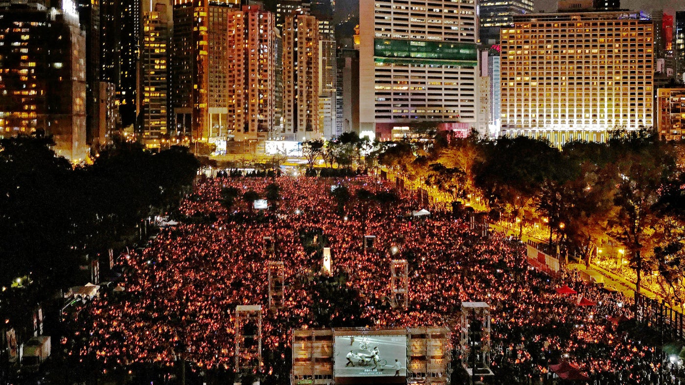 People attending a candlelight vigil