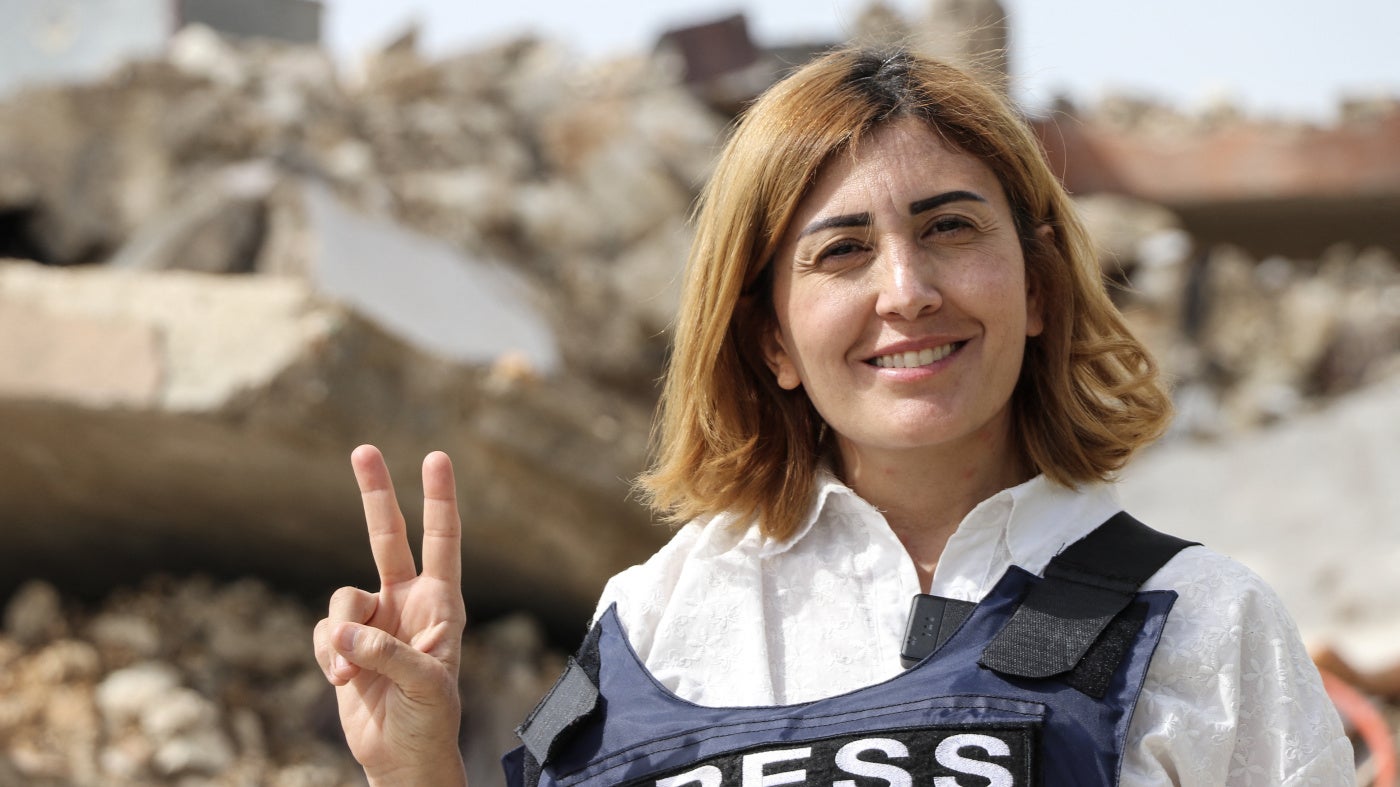 Amal Khalil, a veteran correspondent for the daily newspaper Al-Akhbar, in the southern Lebanese border village of Jebbayn in 2024