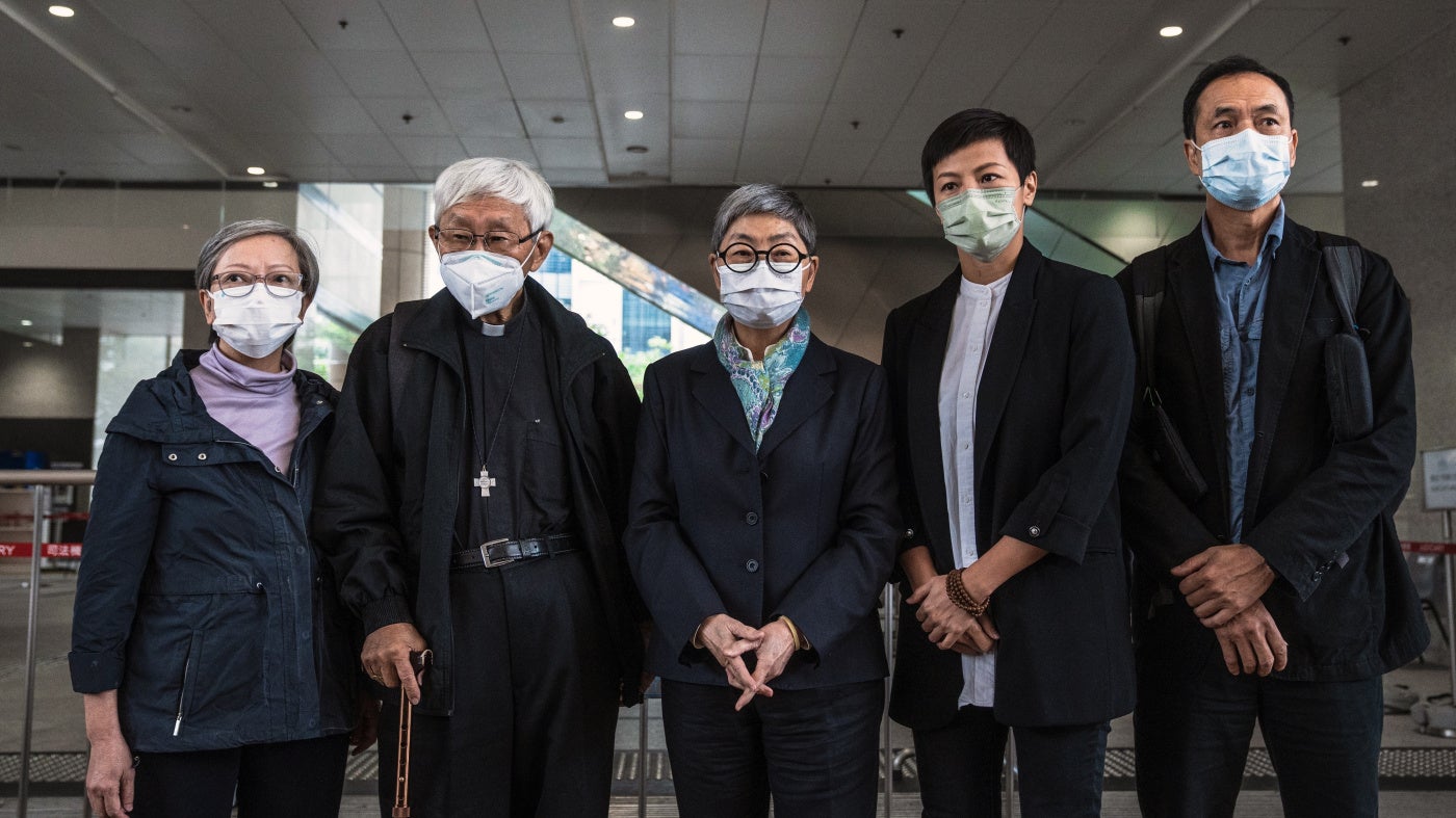 Former trustees of the 612 Humanitarian Relief Fund, following a verdict at the West Kowloon Magistrates' Courts in Hong Kong, November 25, 2022.