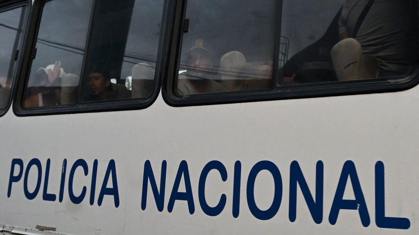 A group of detained fishermen are transported on a National Police bus to the Community Surveillance Unit (UVC) from the port of Manta, Ecuador, on September 4, 2026.
