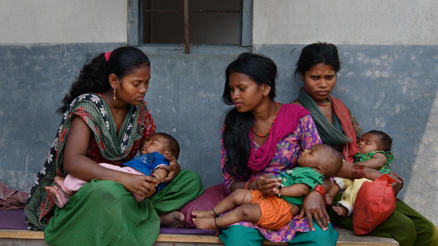 Manju M., 16, Tilmaya M., 18, and Sangeeta M., 19, wait with their children outside of a doctor’s office in Chitwan, Nepal. The parents of Manju M. arranged her marriage to a 19-year-old man when she was 15. Tilmaya M. eloped and married a 20-year-old man