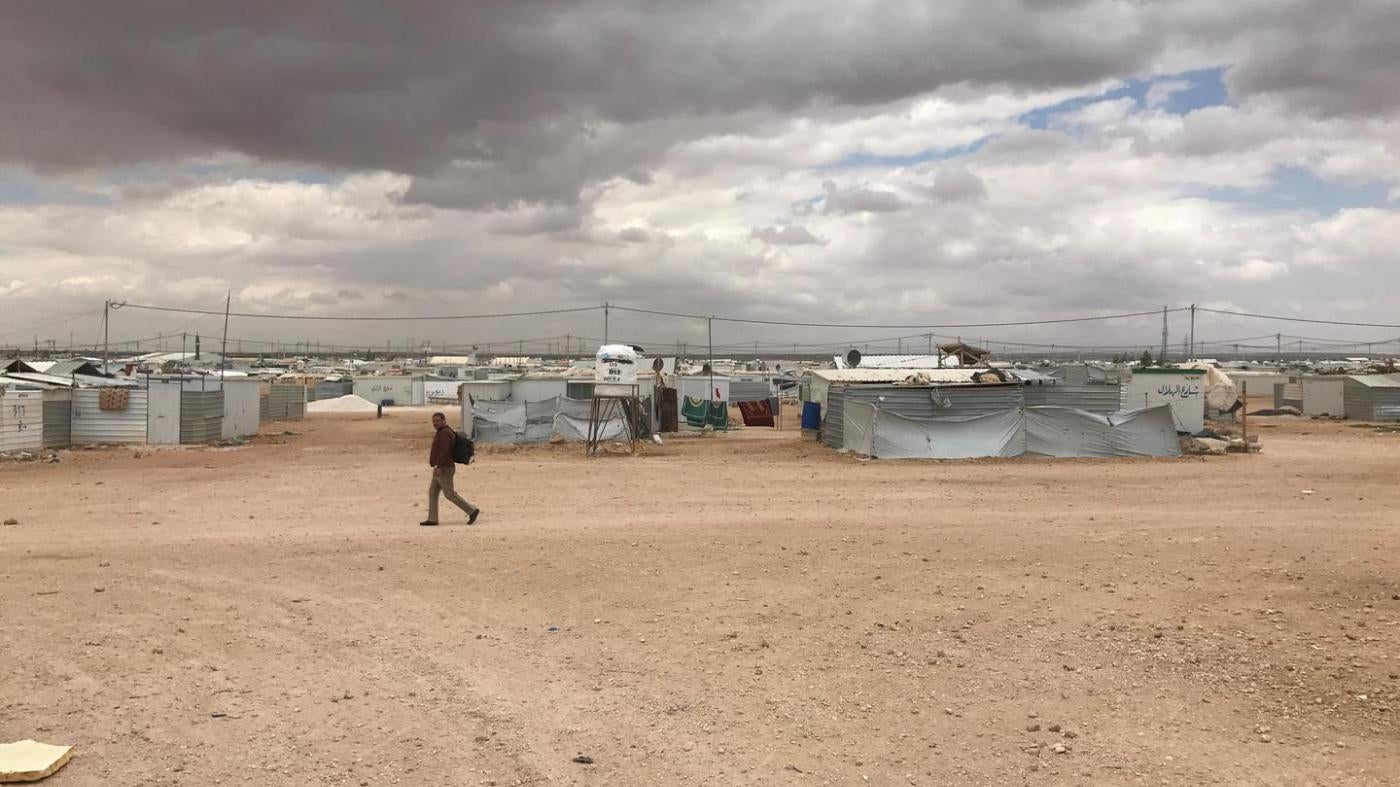 A lone man crosses Zaatari refugee camp in Jordan. The camp population fell from 203,000 during its peak in April 2013 to 80,000 by July 2017.  