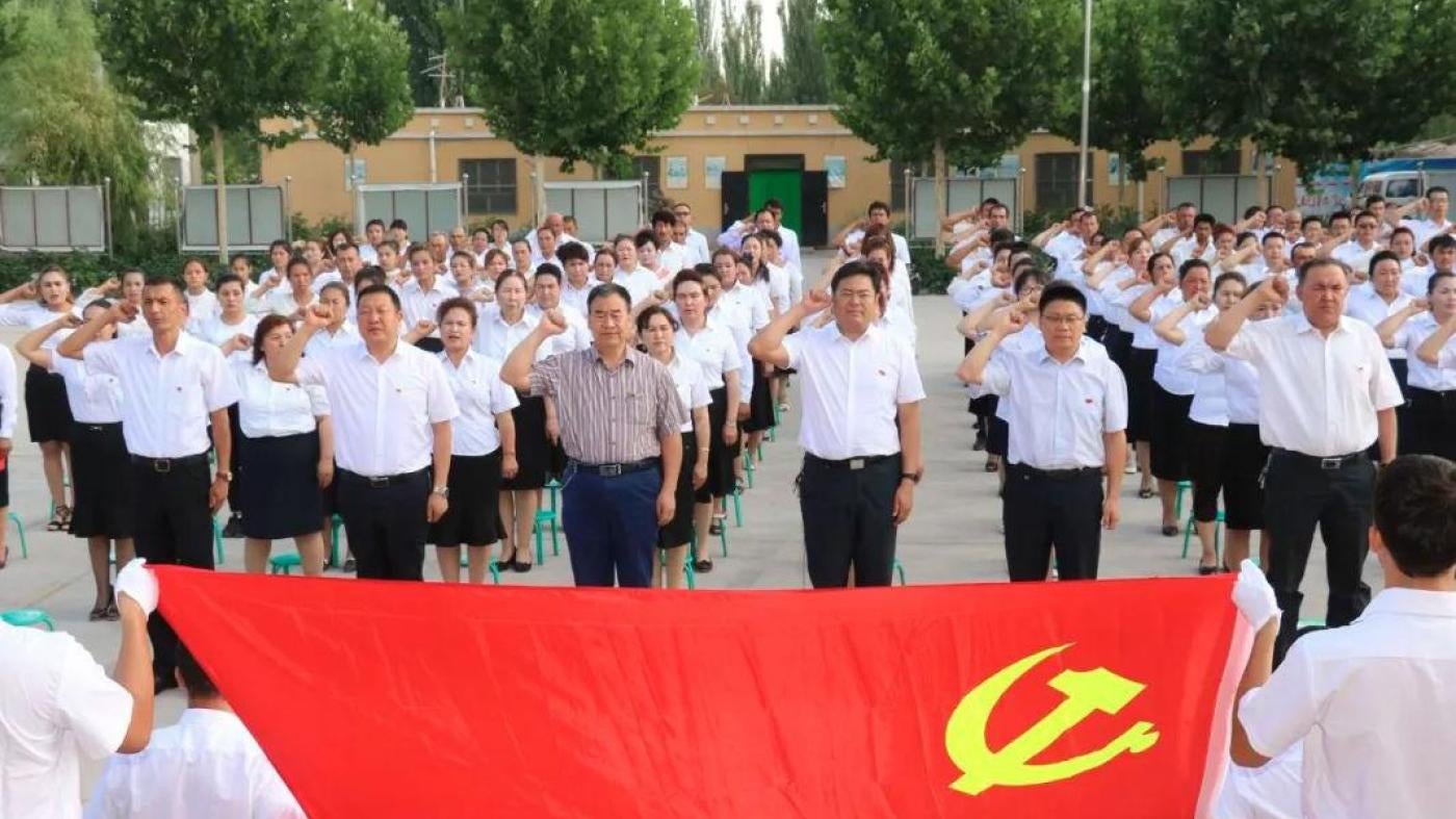 Village officials swear allegiance to the Chinese Communist Party in Kashgar, Xinjiang. 