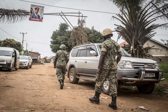 Ugandan soldiers patrol near the house of Ugandan opposition presidential candidate Robert Kyagulanyi, also known as Bobi Wine in Magere, Uganda.
