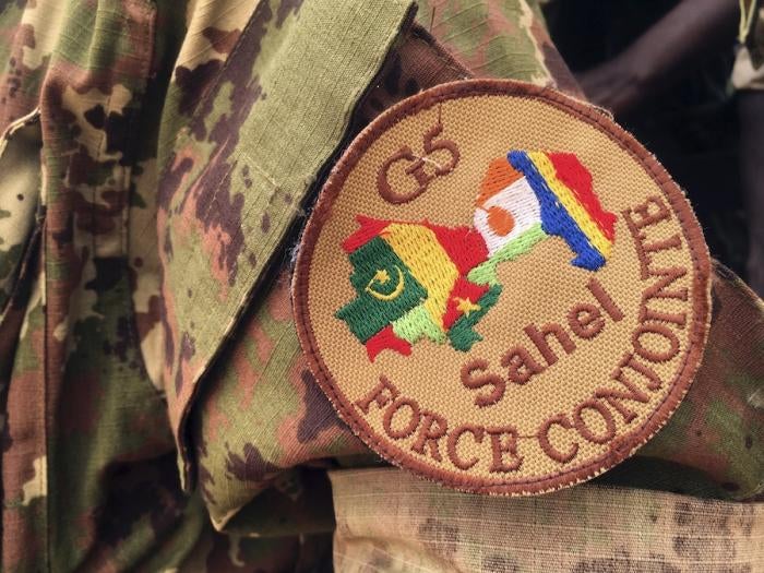 A soldier stands guard in front of the G5-Sahel Counter Terrorism Force headquarters in Mali, May, 30, 2018. 