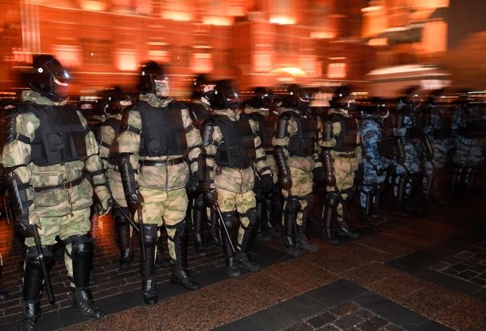Law enforcement officers block access to Red Square in central Moscow, Russia, ahead of a rally protesting a court decision to imprison Russian opposition activist Alexey Navalny, by replacing his suspended sentence with jail time, February 2, 2021.